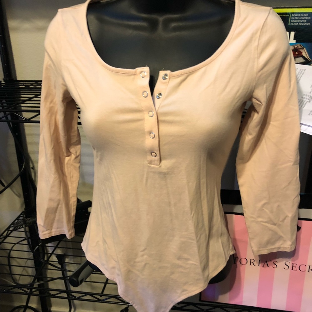 Light pink button up bodysuit